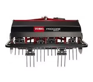 Toro ProCore 648 aerator, black and red, with several metal tines protruding downward.