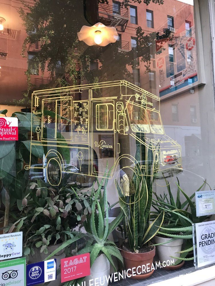 A window with a drawing of a food truck on it