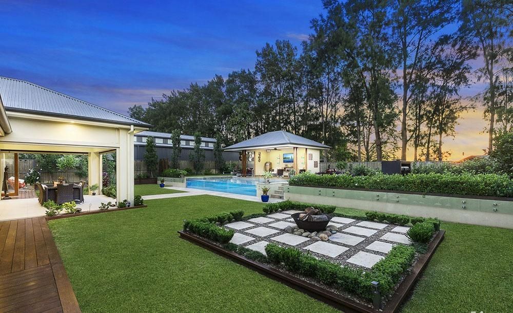 A Large House With A Swimming Pool In The Backyard — Dimension One Glass Fencing In Tuggerah, NSW