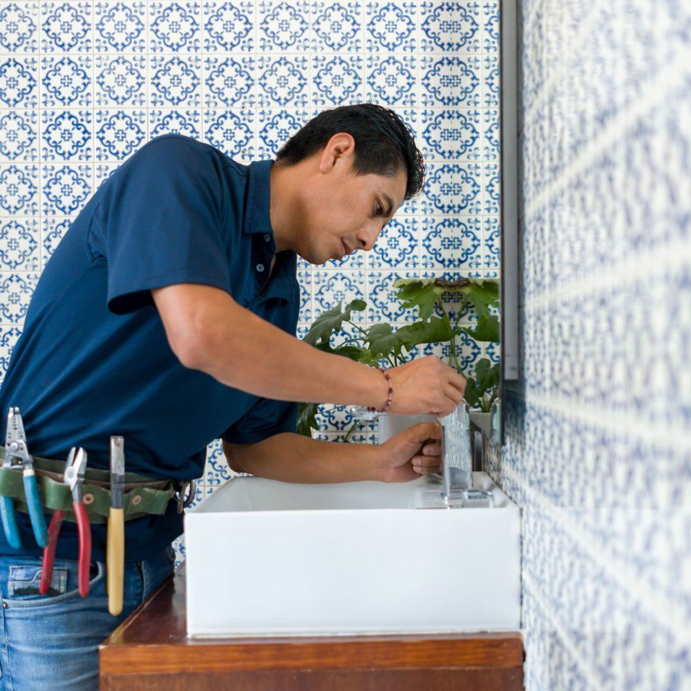 Plumber Repairing Faucet — Bartlesville, OK — Mason's Plumbing