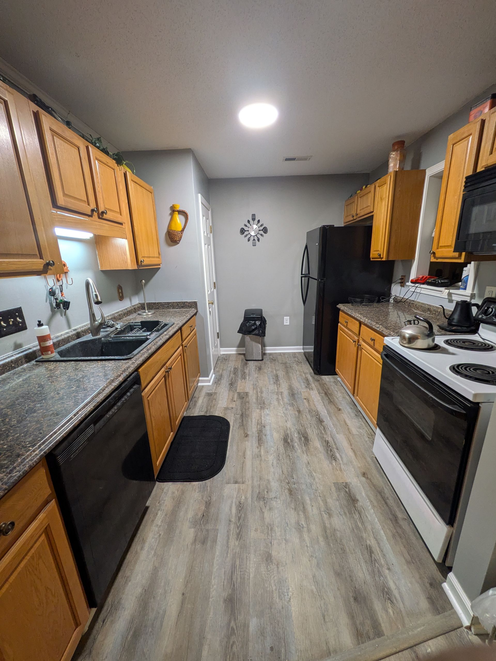 A room with a lot of shelves and bins in it