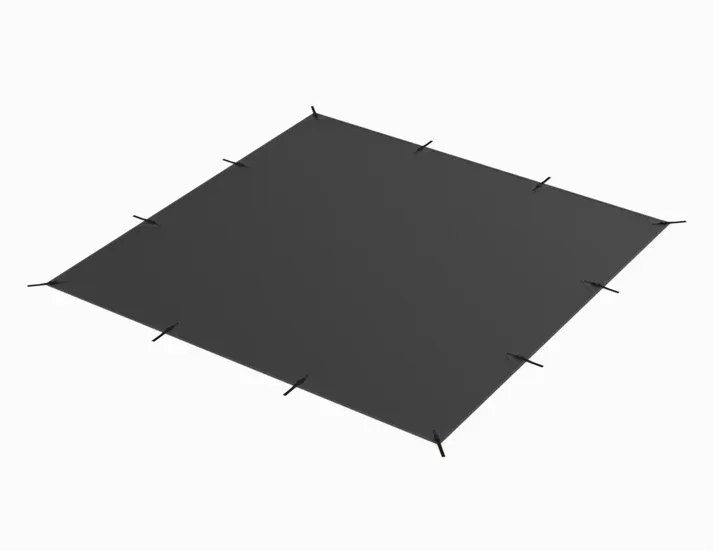 A black tarp is sitting on top of a white surface.