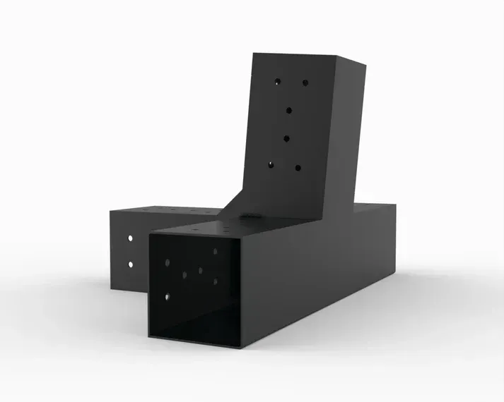 Two black metal blocks are sitting next to each other on a white surface.