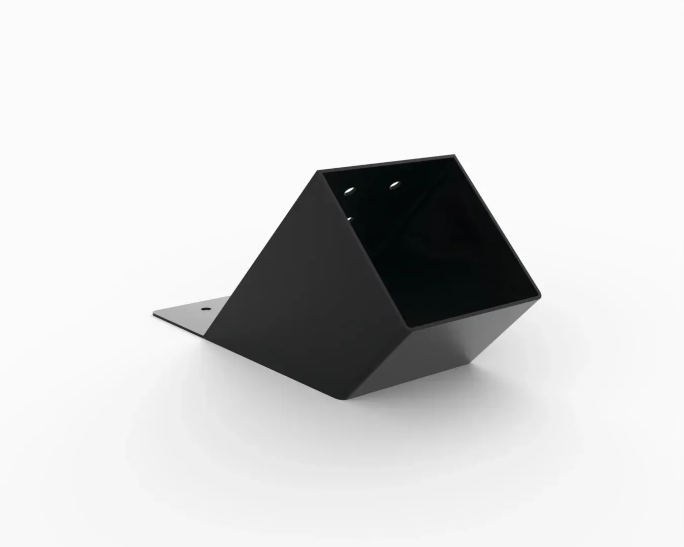 A black cube is sitting on a white surface.