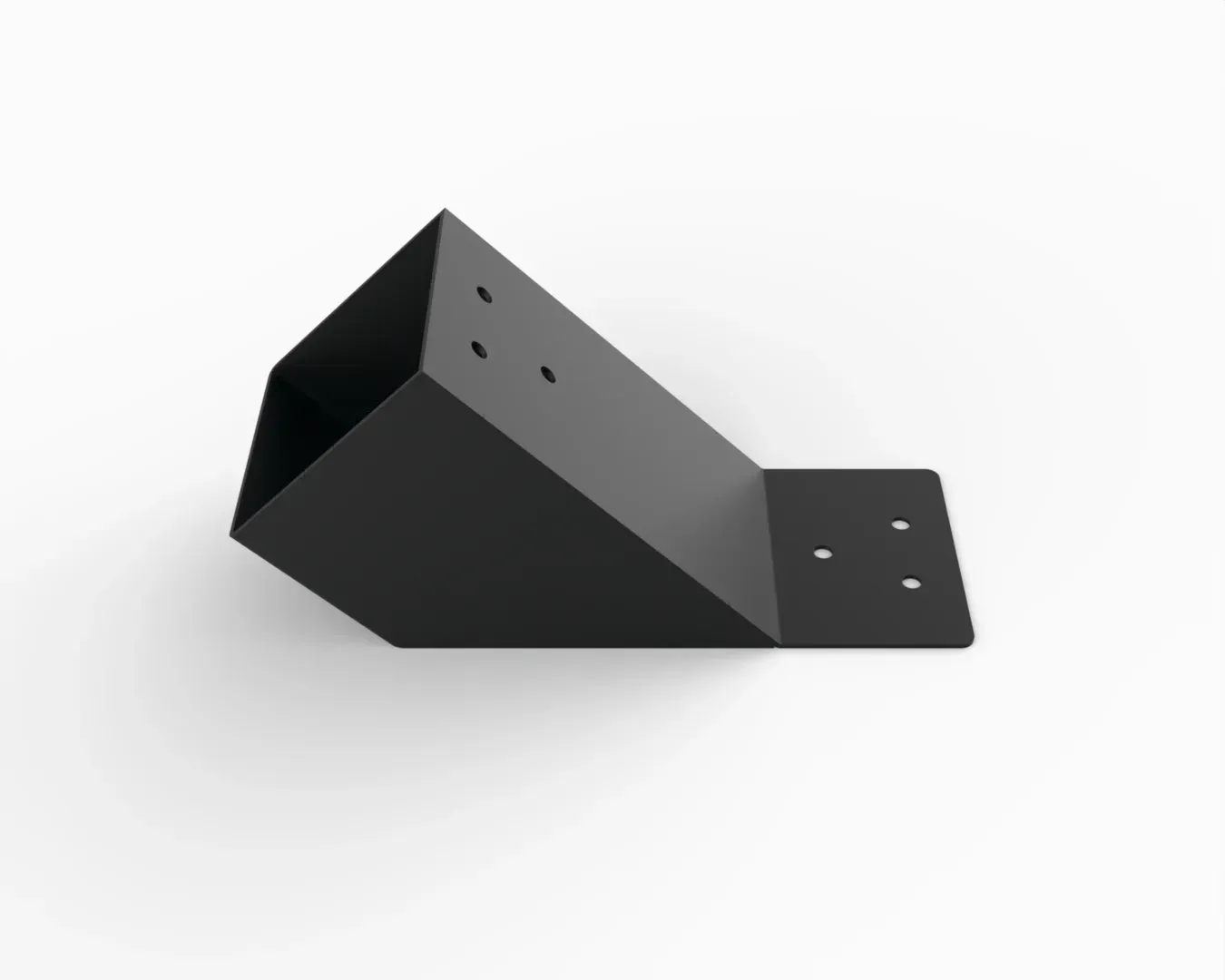 A black metal object is sitting on a white surface.