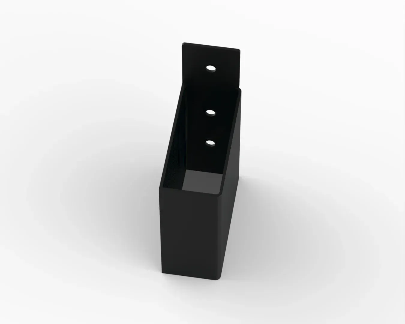 A black box with holes in it is sitting on a white surface.