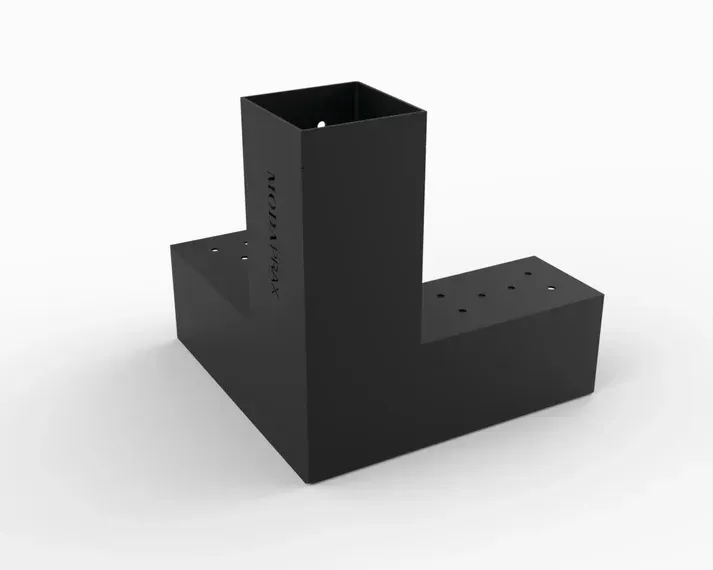 A black metal pipe with holes in it is sitting on a white surface.