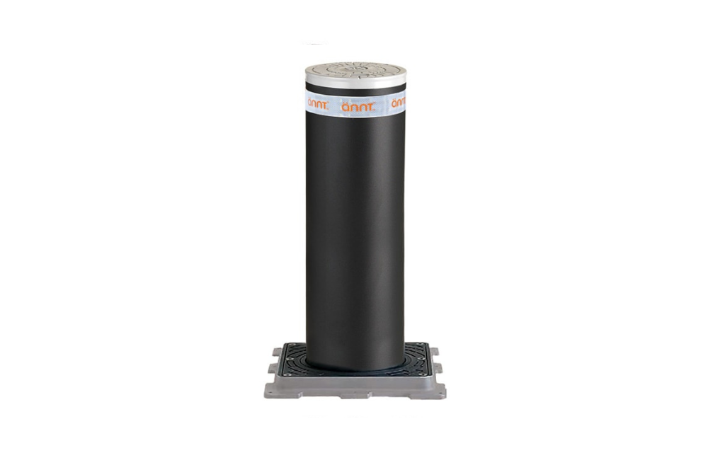 A black cylindrical object is sitting on a white surface.