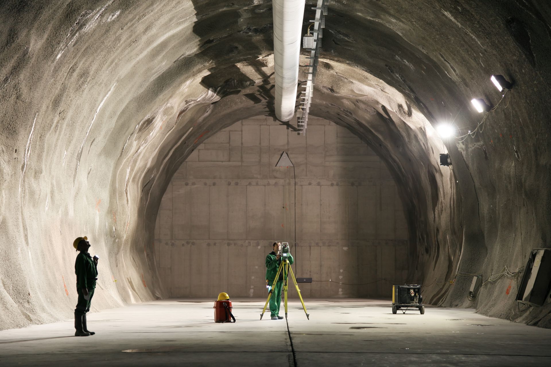A miner and a surveyor working underground.