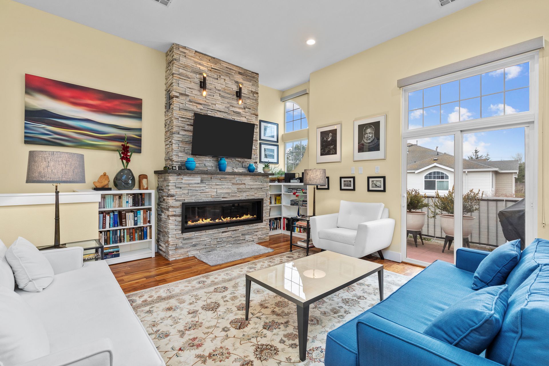 Living room with stone fireplace.