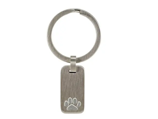 Silver key ring with a rectangular metal tag engraved with a paw print