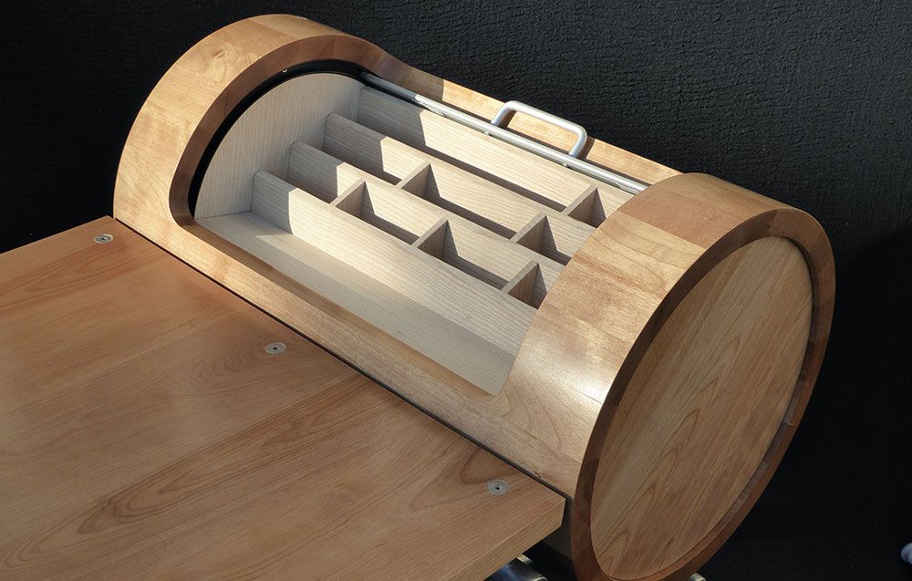 A hand crafted modern designer table with a barrel shaped container