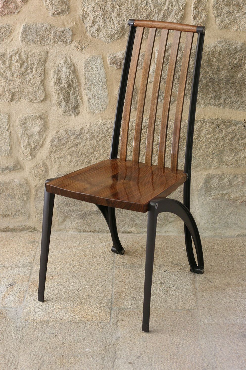Designer walnut and cast dining chair crafted by sebastian blakeley