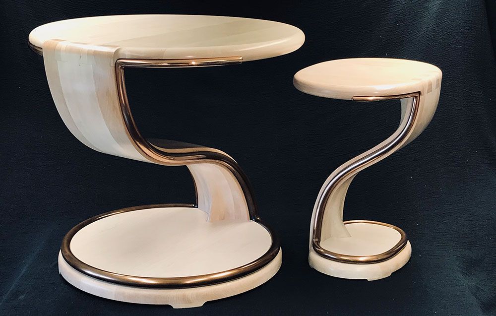 A small table and a large table are sitting next to each other