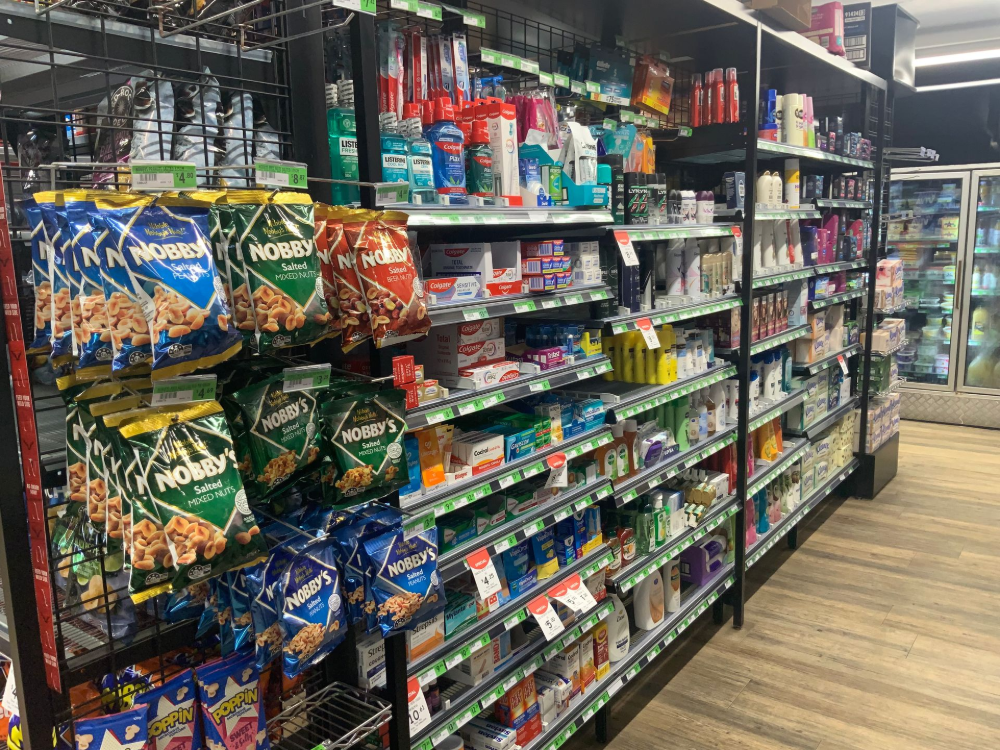 Shelves of assorted snacks — Cedar Park Supermarket In Taranganba, QLD