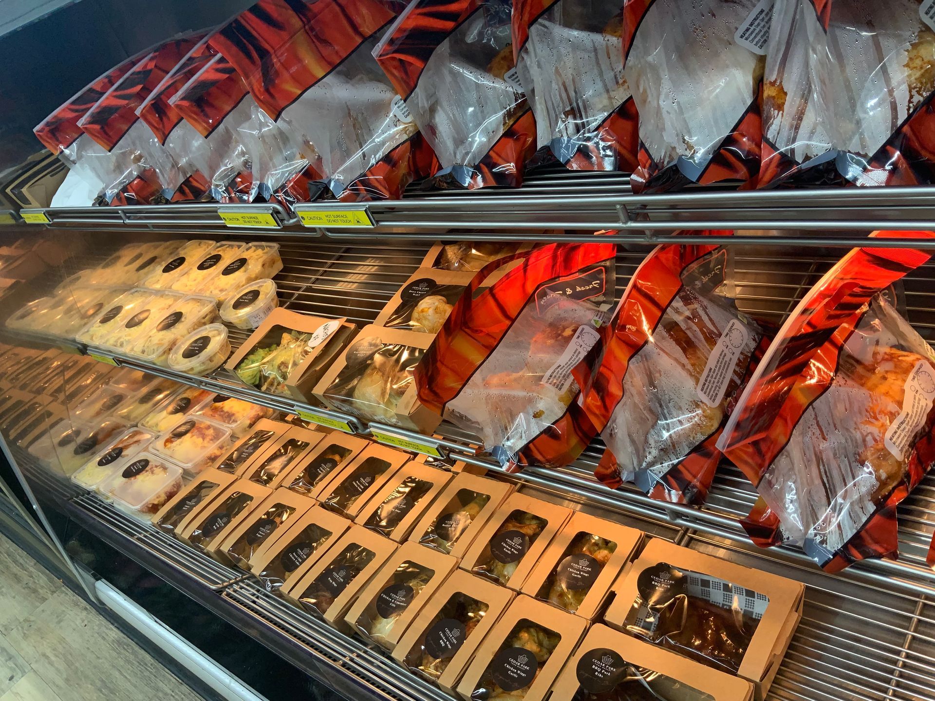Packaged roast chickens in a cabinet — Cedar Park Supermarket In Taranganba, QLD