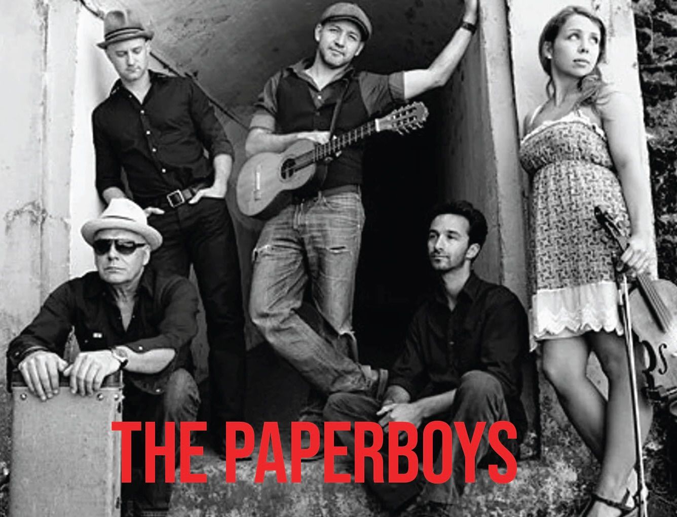 A black and white photo of the paperboys