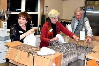 A group of people are working together in a kitchen