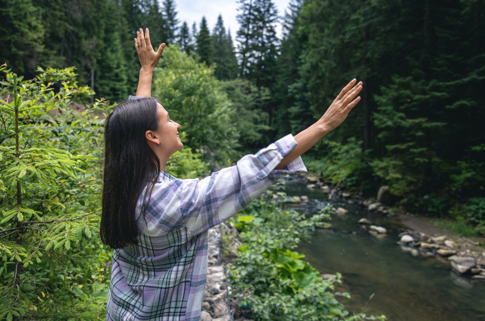Happy young woman in a forest