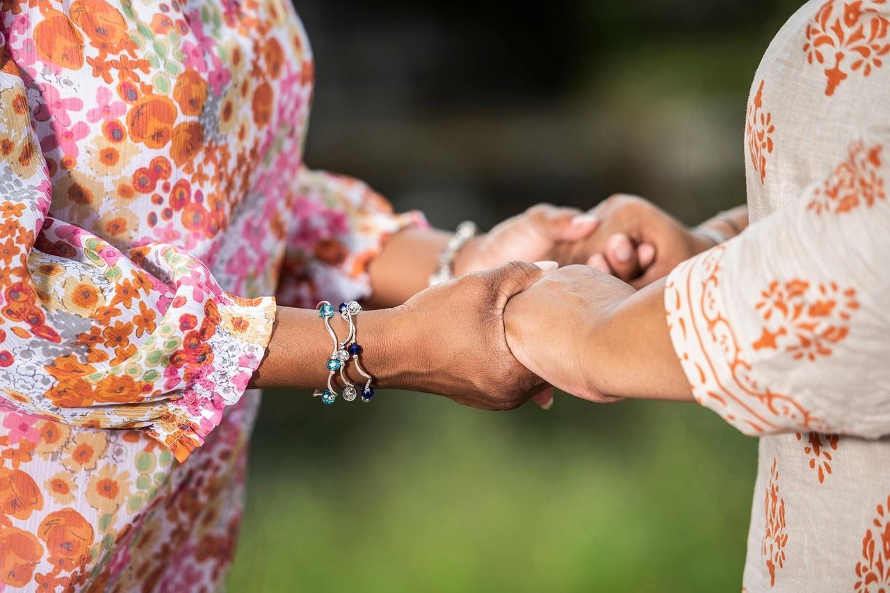 Hands joined together in prayer, symbolizing comfort, unity, and care provided by funeral homes Jord