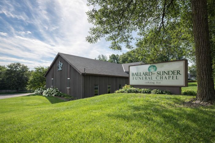 Exterior of Ballard-Sunder Funeral Chapel surrounded by trees and greenery, representing Shakopee, MN funeral home and cremations.