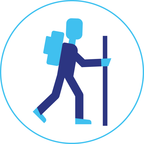 A man with a backpack and a stick is walking in a circle.