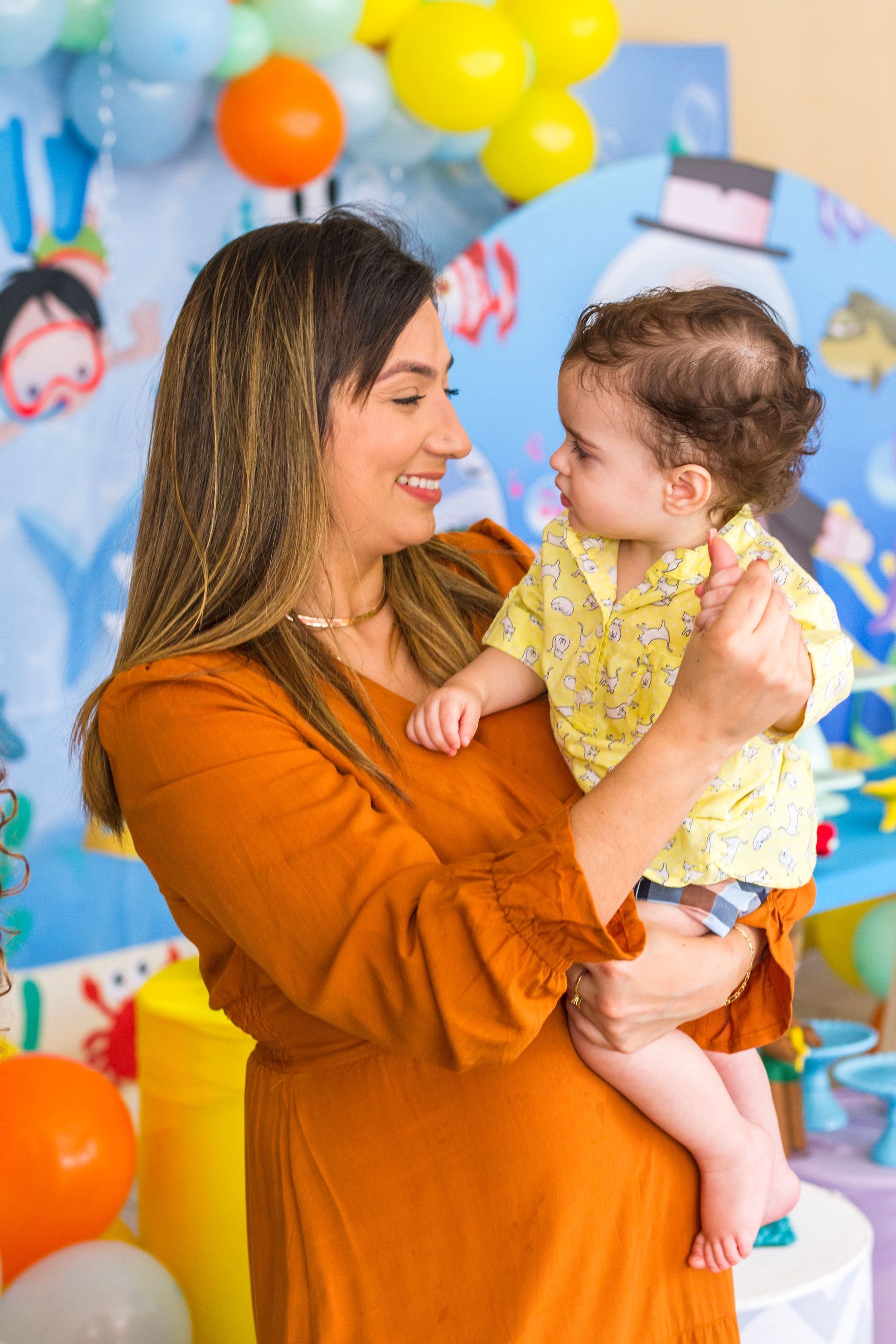 photorealistic professional caregiver and young child looking at a picture book together in a bright cozy corner focused engagement