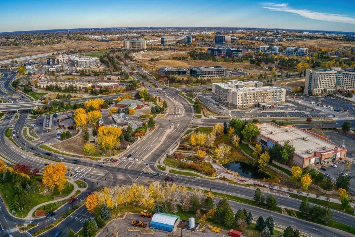 An aerial view of a city with a lot of buildings and trees.