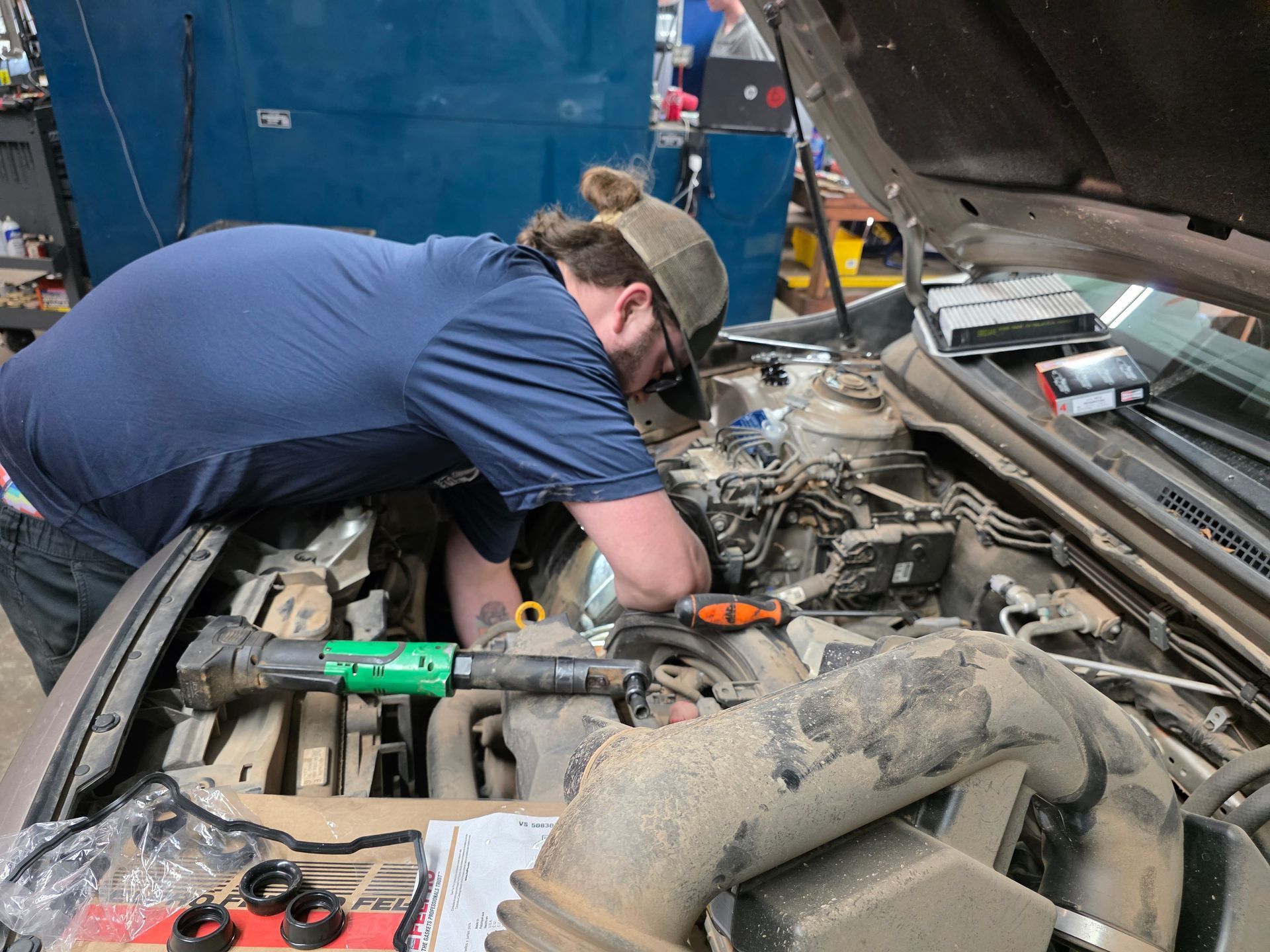 Our Mechanic Works on a Truck's  Engine in Stillwater, OK | Kaiser Automotive