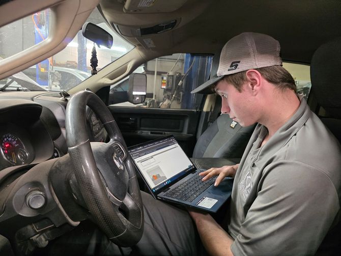 Our Certified Mechanic Diagnoses a Vehicler on Laptop in Stillwater, OK | Kaiser Automotive 