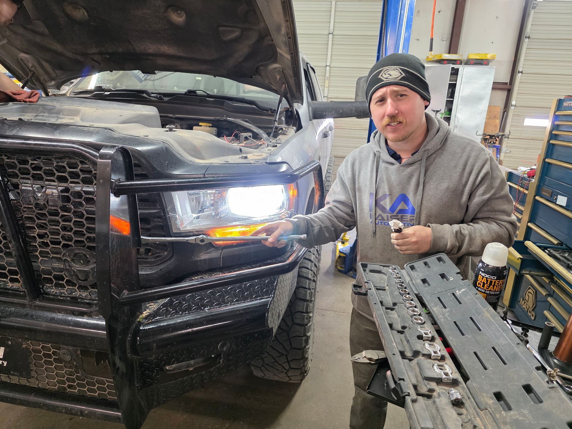 Our Certified Mechanic Checks a Truck's Headlight in Stillwater, OK | Kaiser Automotive