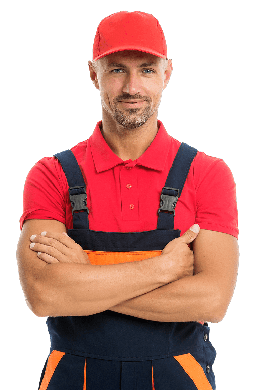 a man in overalls and a red hat is standing with his arms crossed .