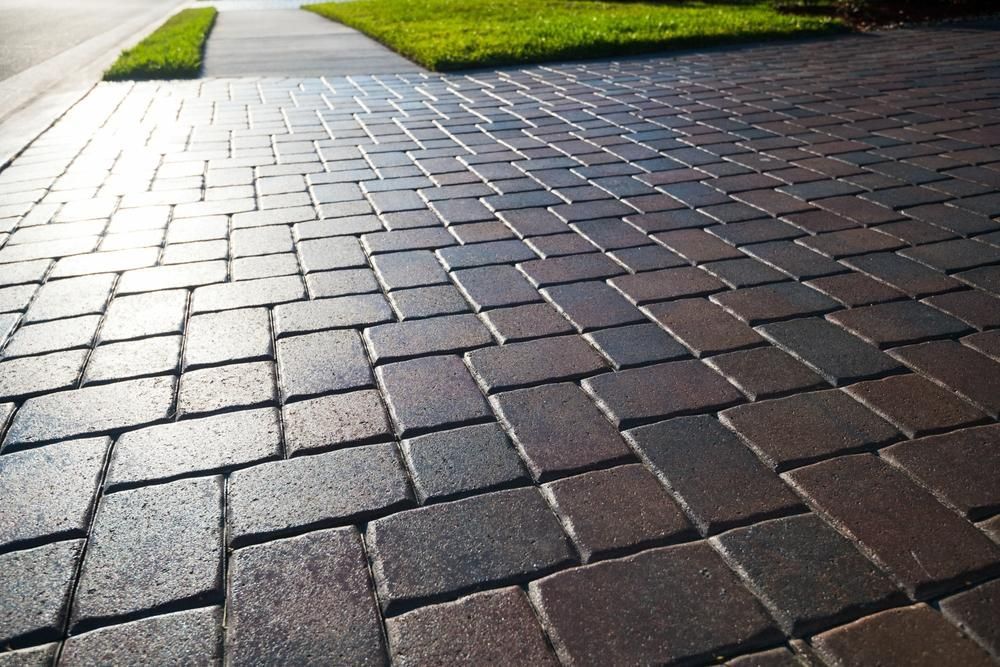 A Brick Driveway with A Sidewalk in The Background — S & L Sand & Gravel in Bangalow, NSW