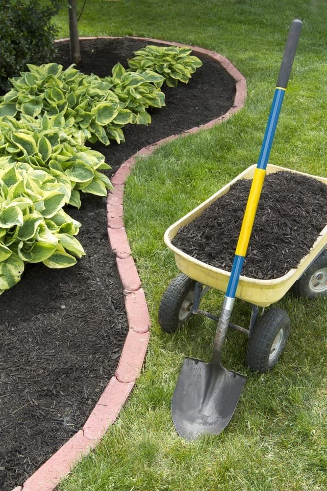 Curved Garden Bed With Shovel in Lismore