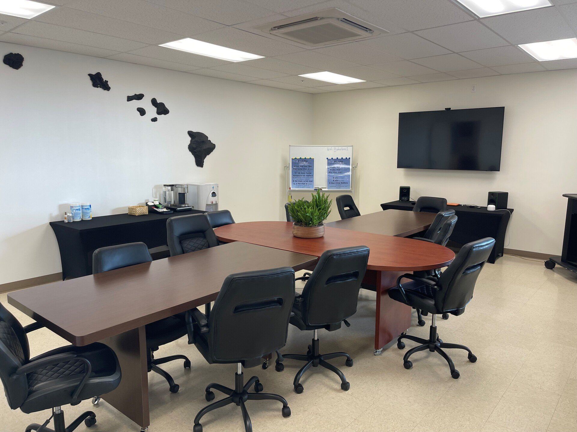 A conference room with a large table and chairs