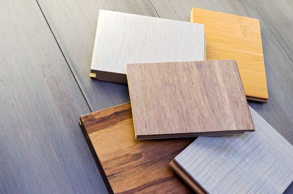 Wood Are Stacked On Top Of Each Other On A Wooden Table — Corbett Brothers Flooring In Hunter Valley, NSW