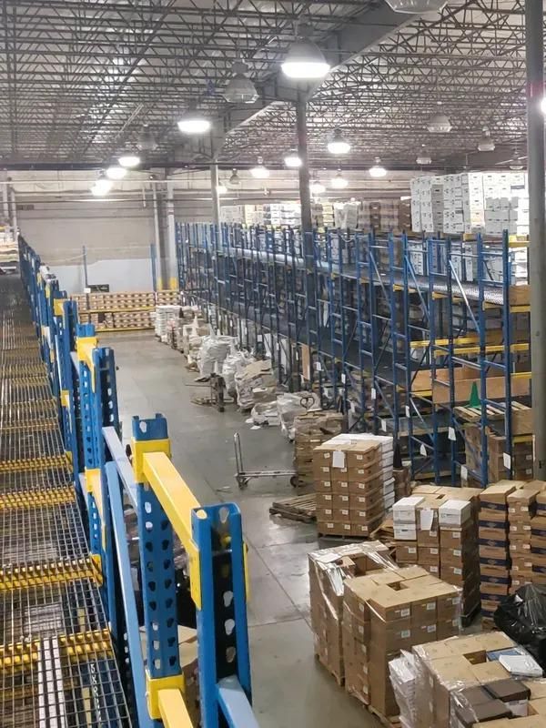 A large warehouse filled with lots of boxes and shelves