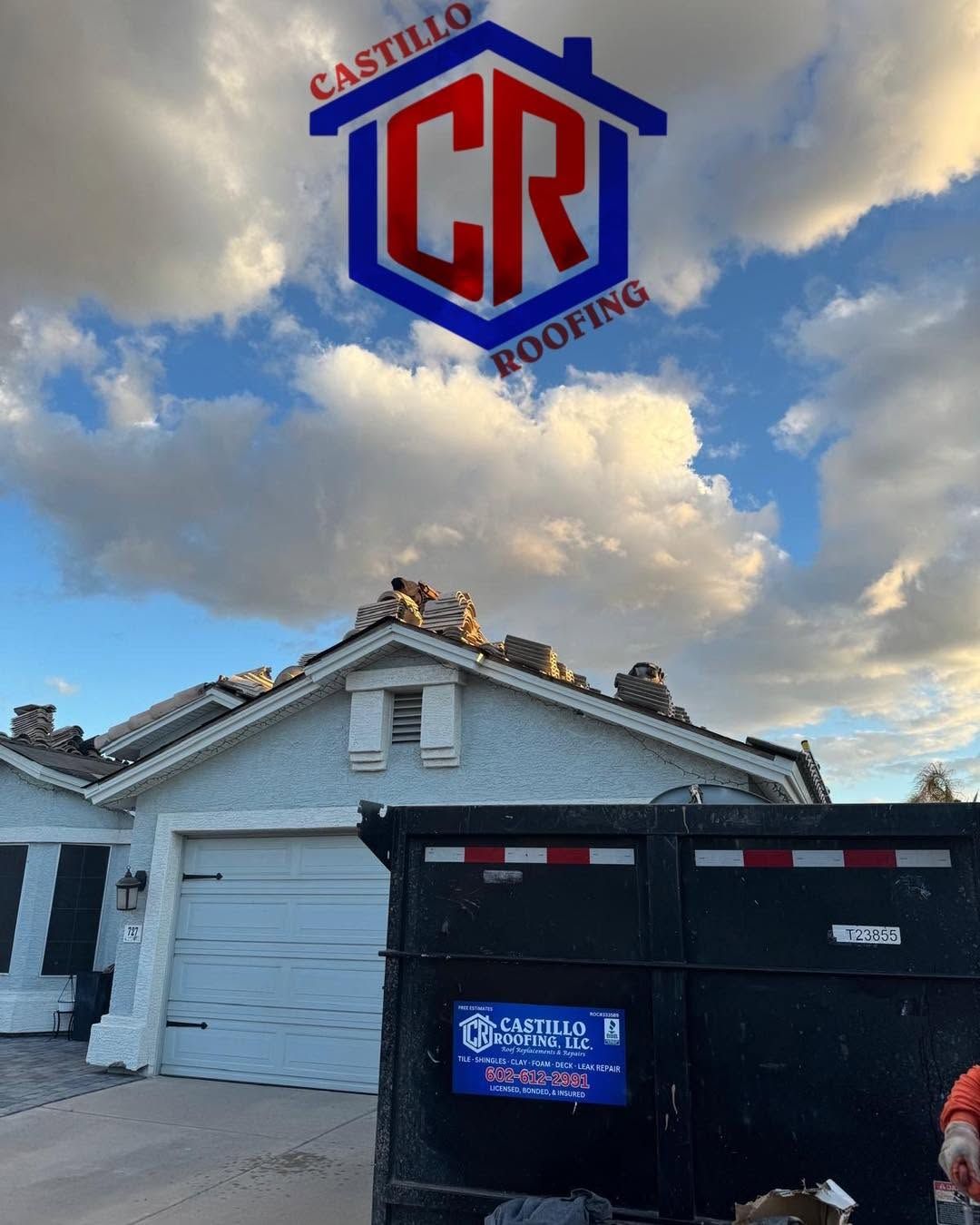 House roof under repair with CR Roofing logo and dumpster in front under a cloudy sky