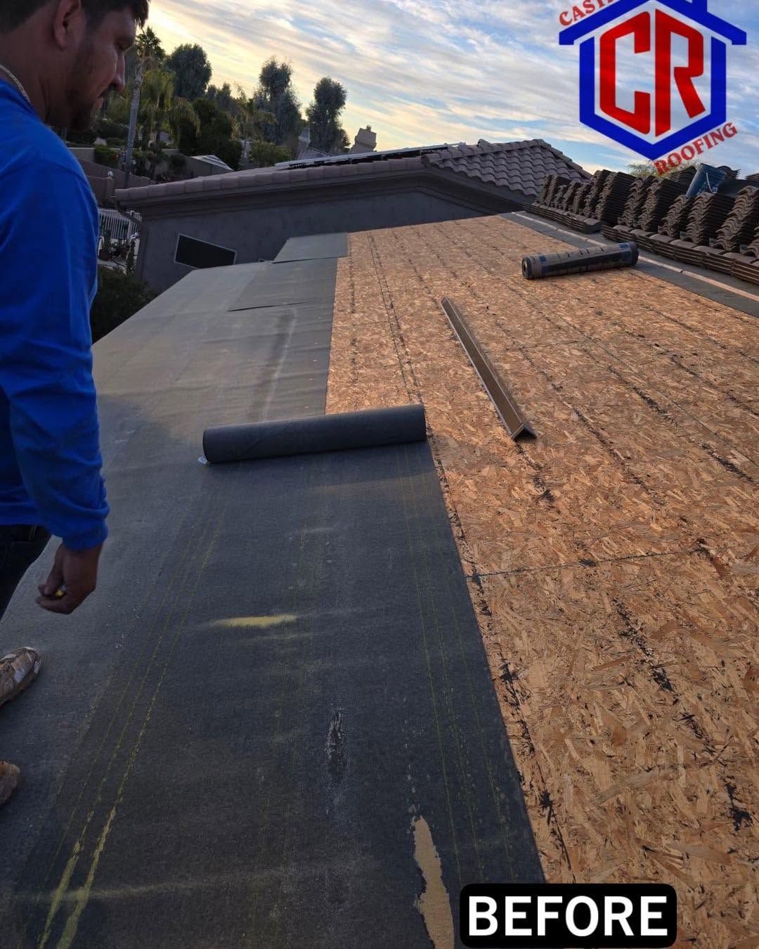 Roofing worker laying black underlayment on a sloped roof during repair, labeled “BEFORE”
