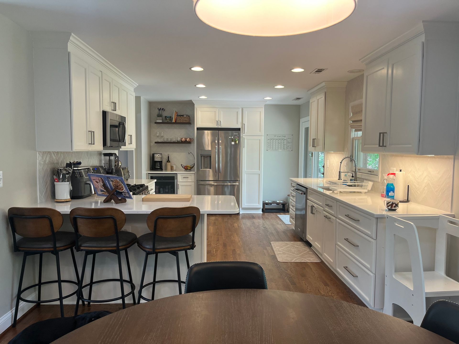 Open-concept Kitchen Renovation in severna park maryland by American Remodeling Corp. Custom cabinets and backsplash