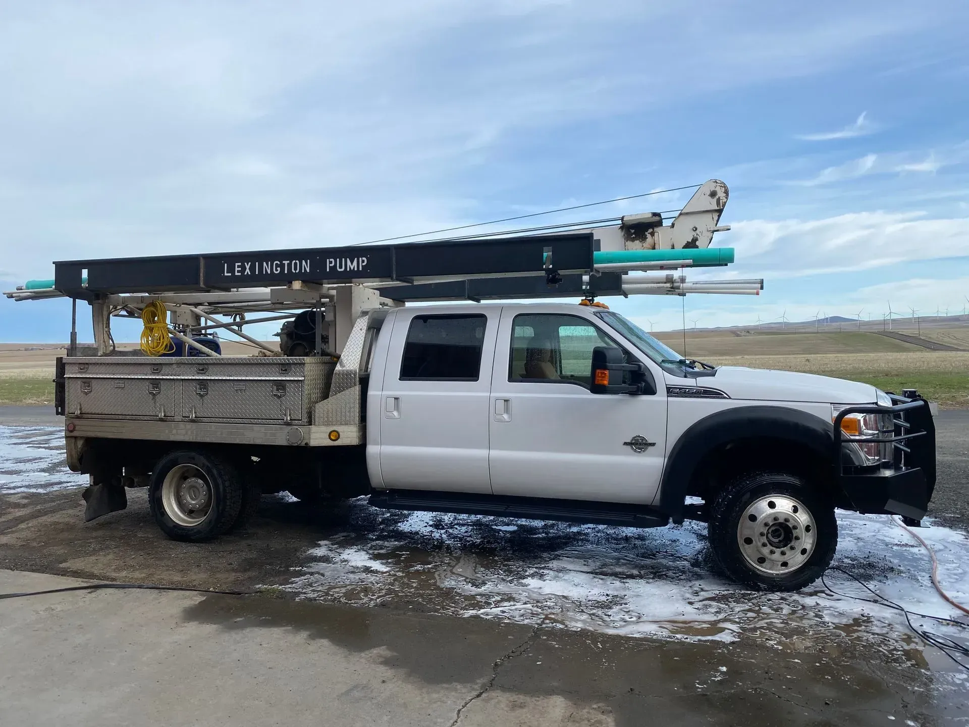 A white truck with a ladder