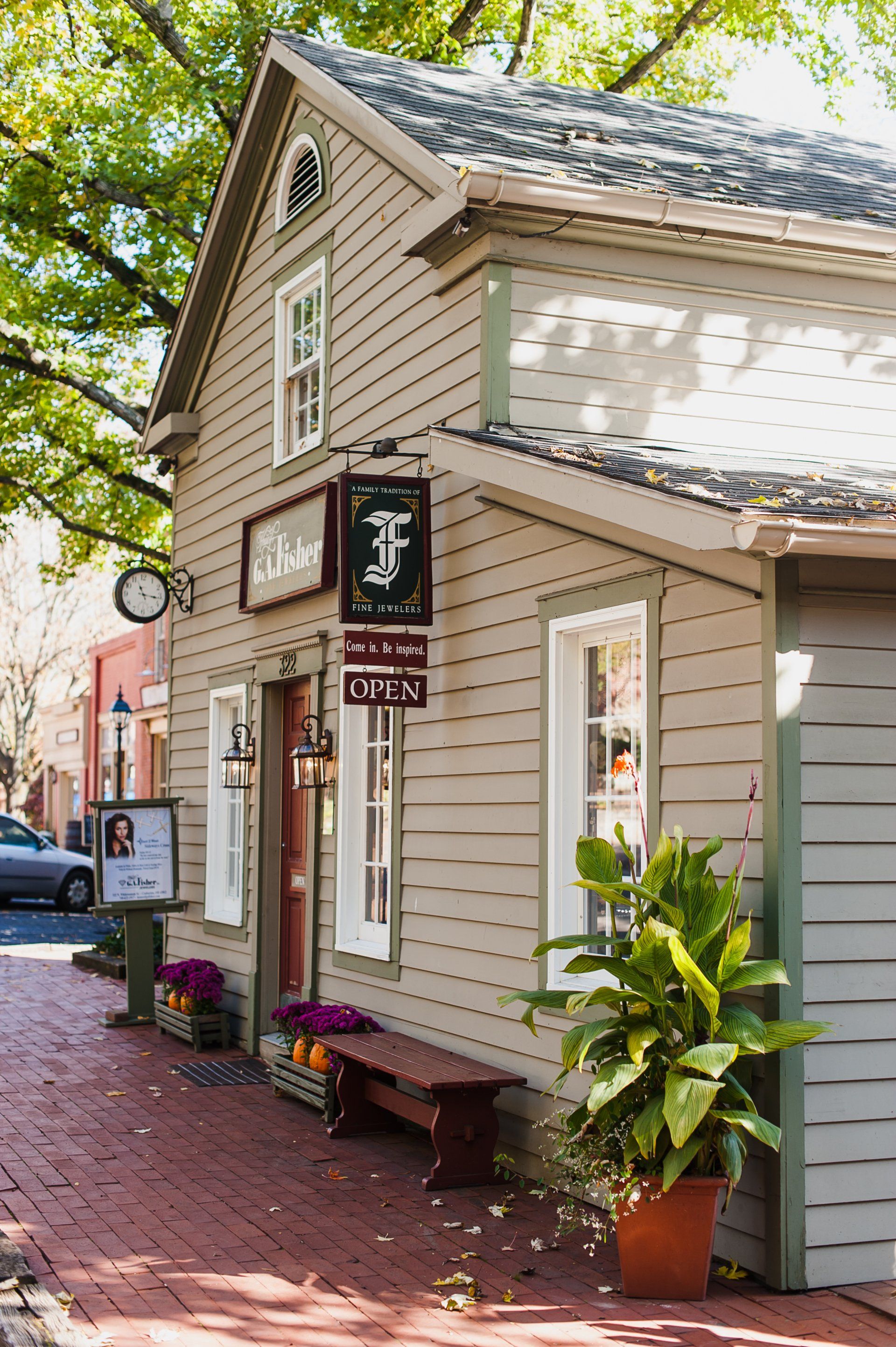 Quaint beige building with sign
