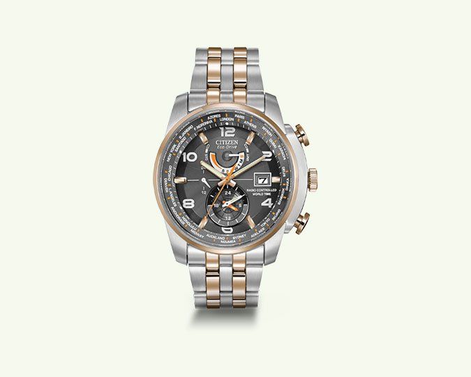 Silver and rose gold watch with a dark gray face and chronograph features.