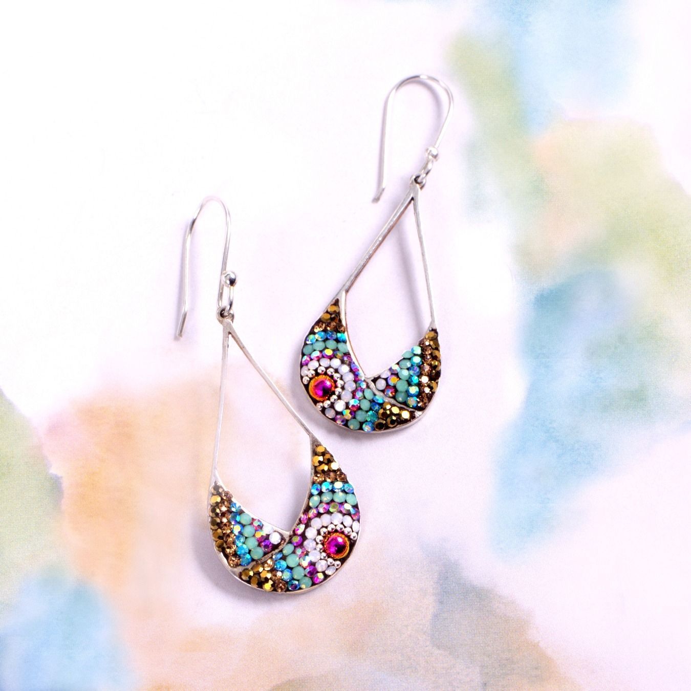Silver teardrop earrings with colorful beadwork: turquoise, gold, and pink accents.