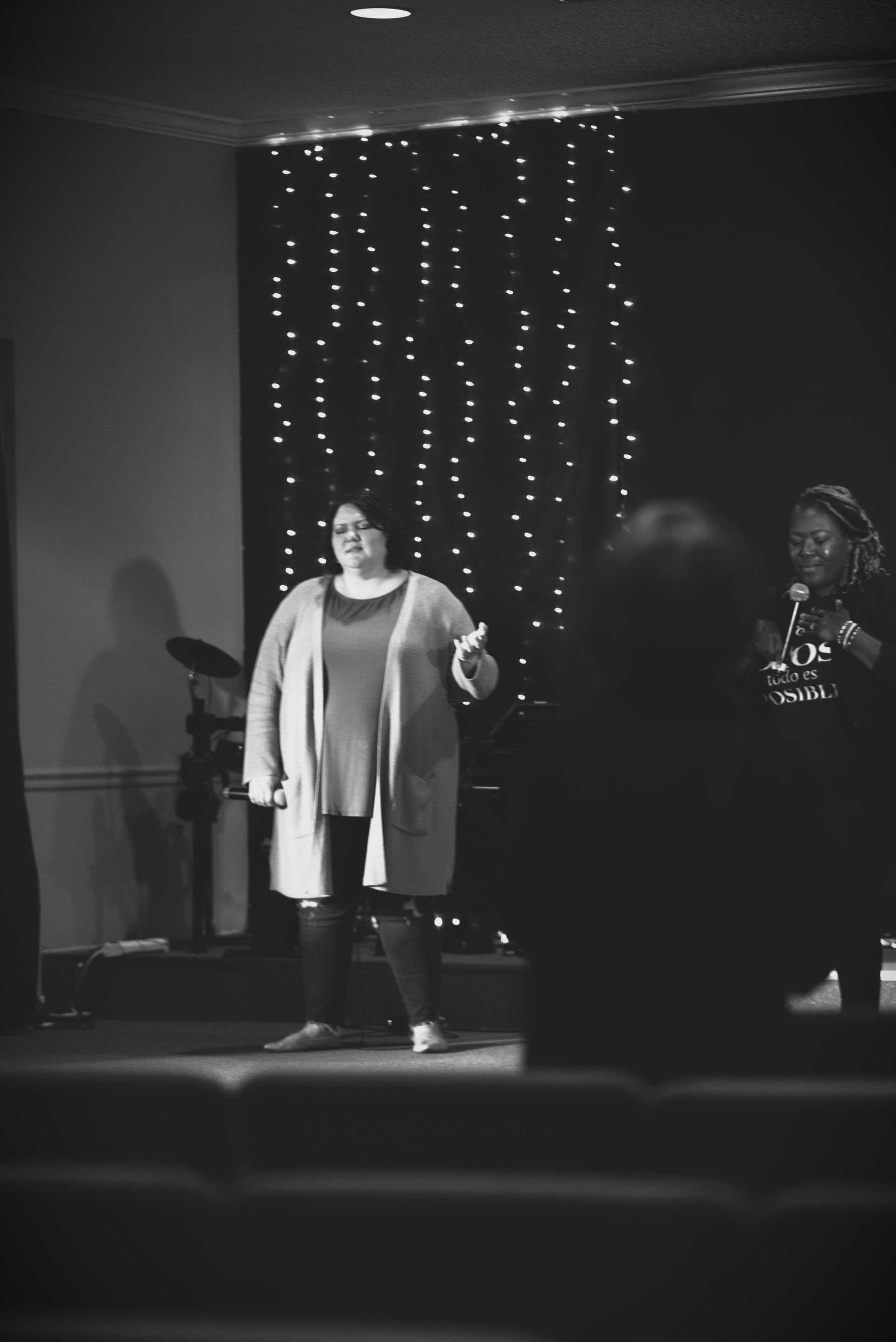 A black and white photo of part of the worship team. 