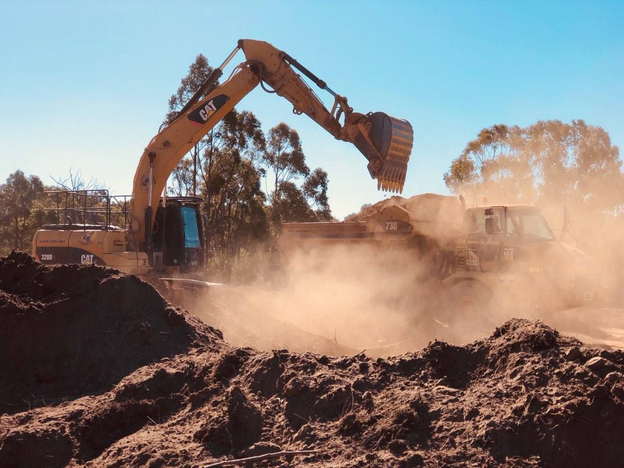 Digger With Bucket — Marulan, NSW — Coopers Earthmoving Pty Ltd