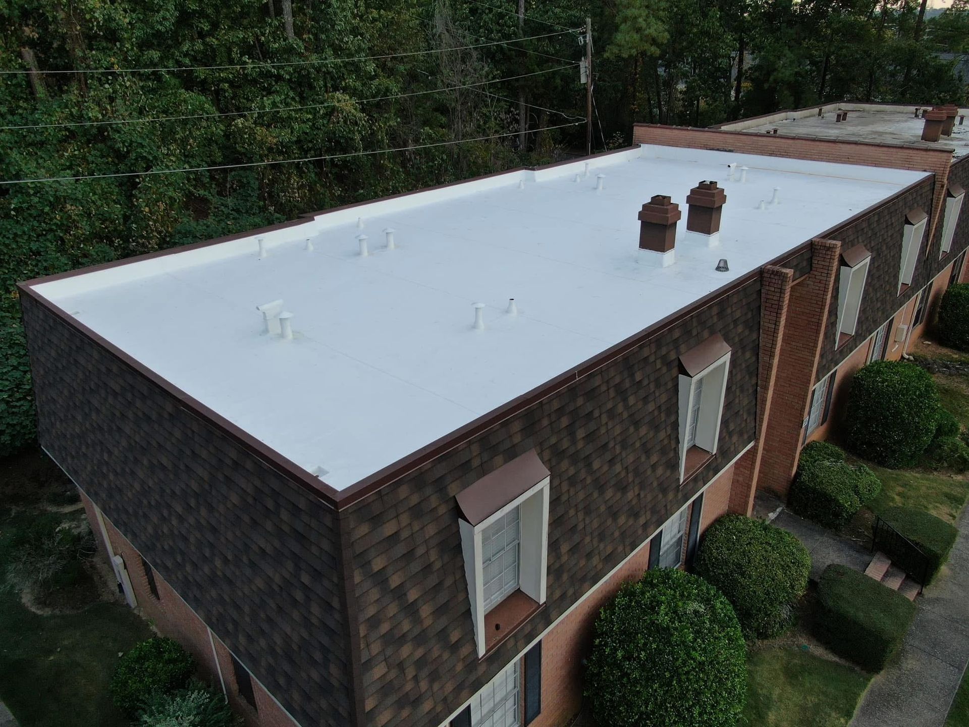 A gutter attached to the side of a building, efficiently directing rainwater away from the structure to prevent water damage.