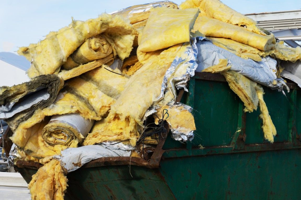 An image of used insulation in a bin.