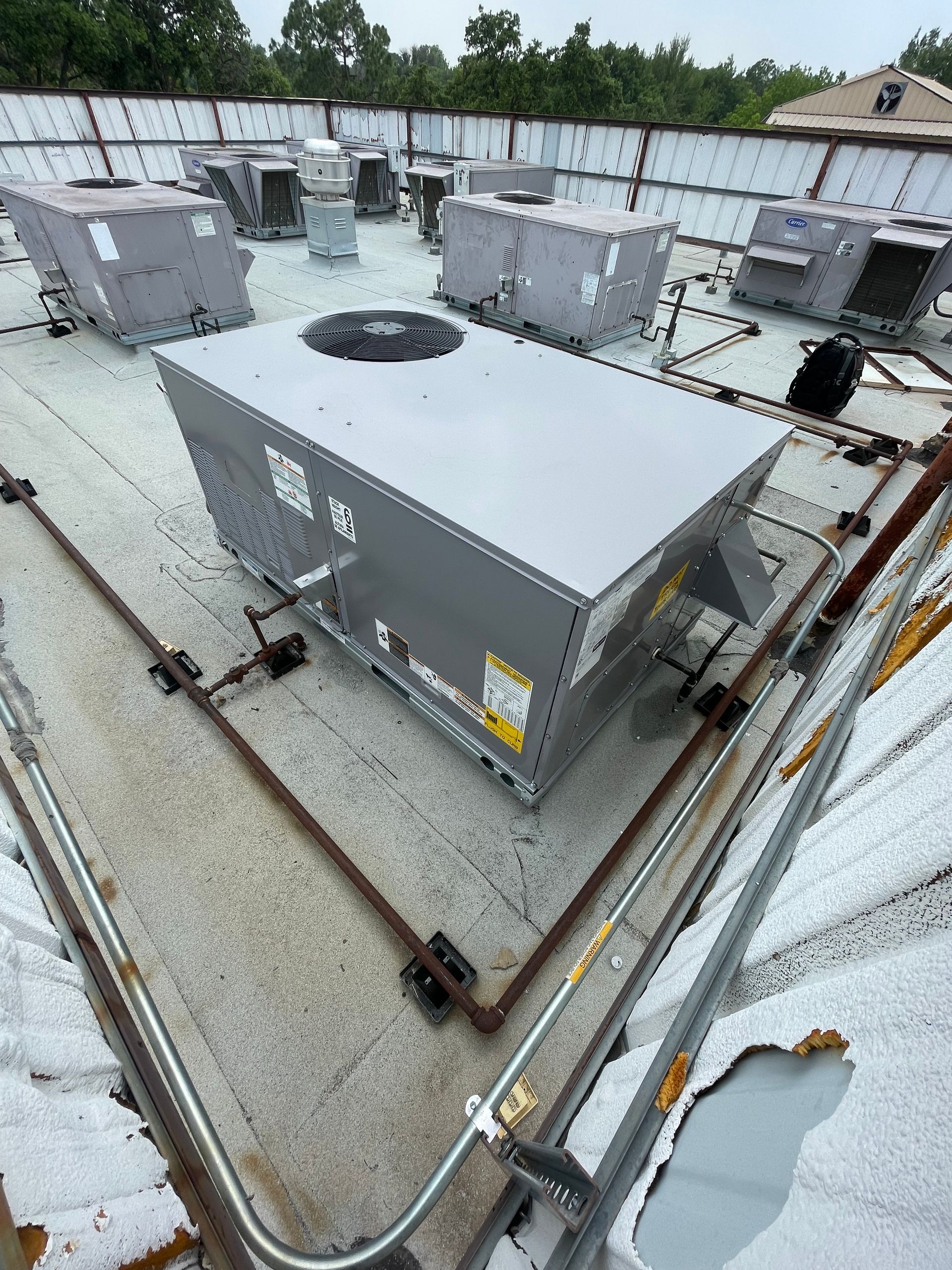 a large gray box is sitting on top of a roof .