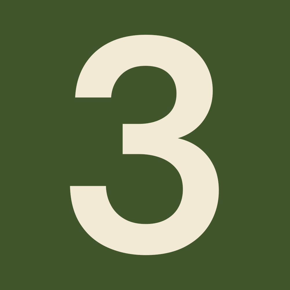 A white number three is on a green background.